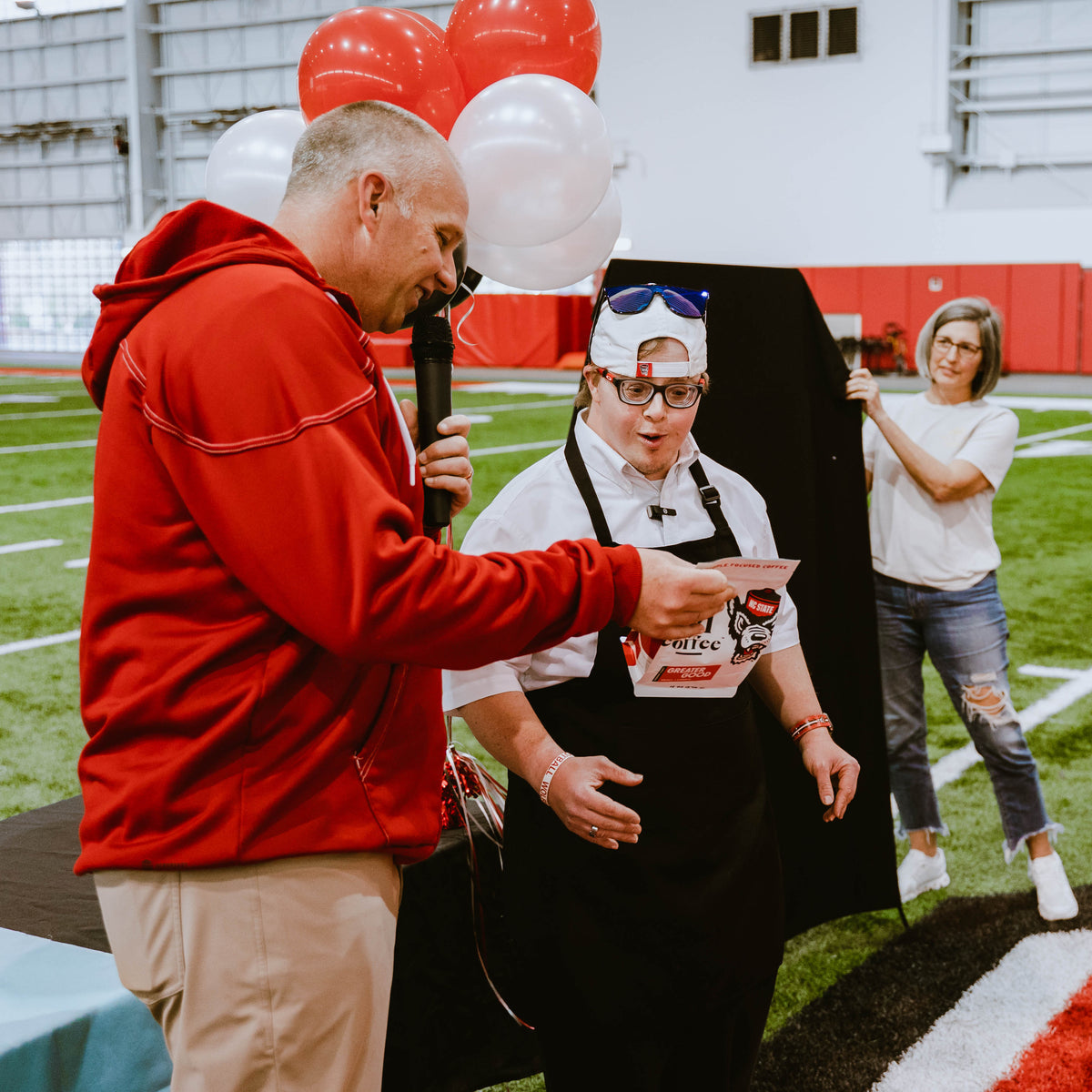NC State Football coach Dave Doeren reveals the bag of Greater Good to Sam for the first time ever.