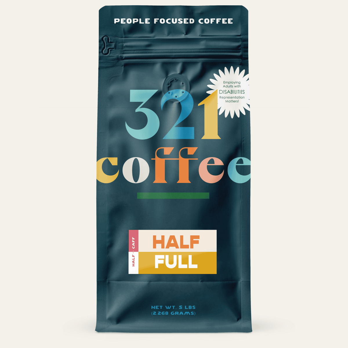 A navy blue bag with "321 Coffee" written in colorful letters. Below that, the blend name, Half Full, is written on a colorful background.