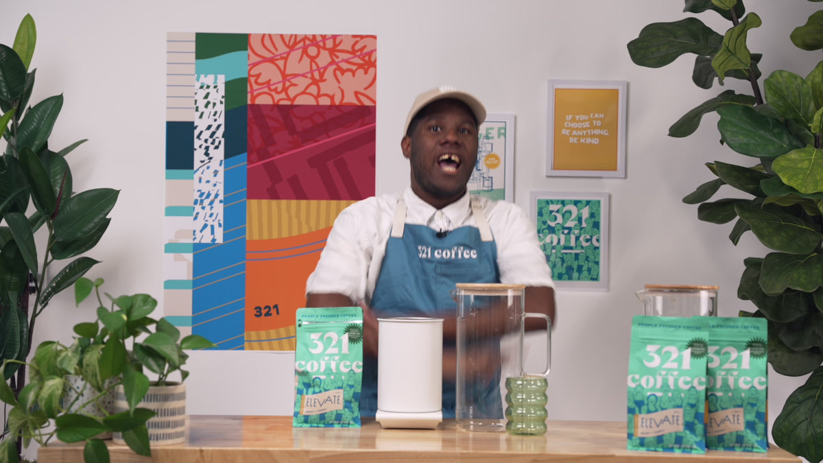 Aaron, a 321 Coffee barista, introduces the cold brew guide and says, "Hey! My name is Aaron. Make cold brew with me!"