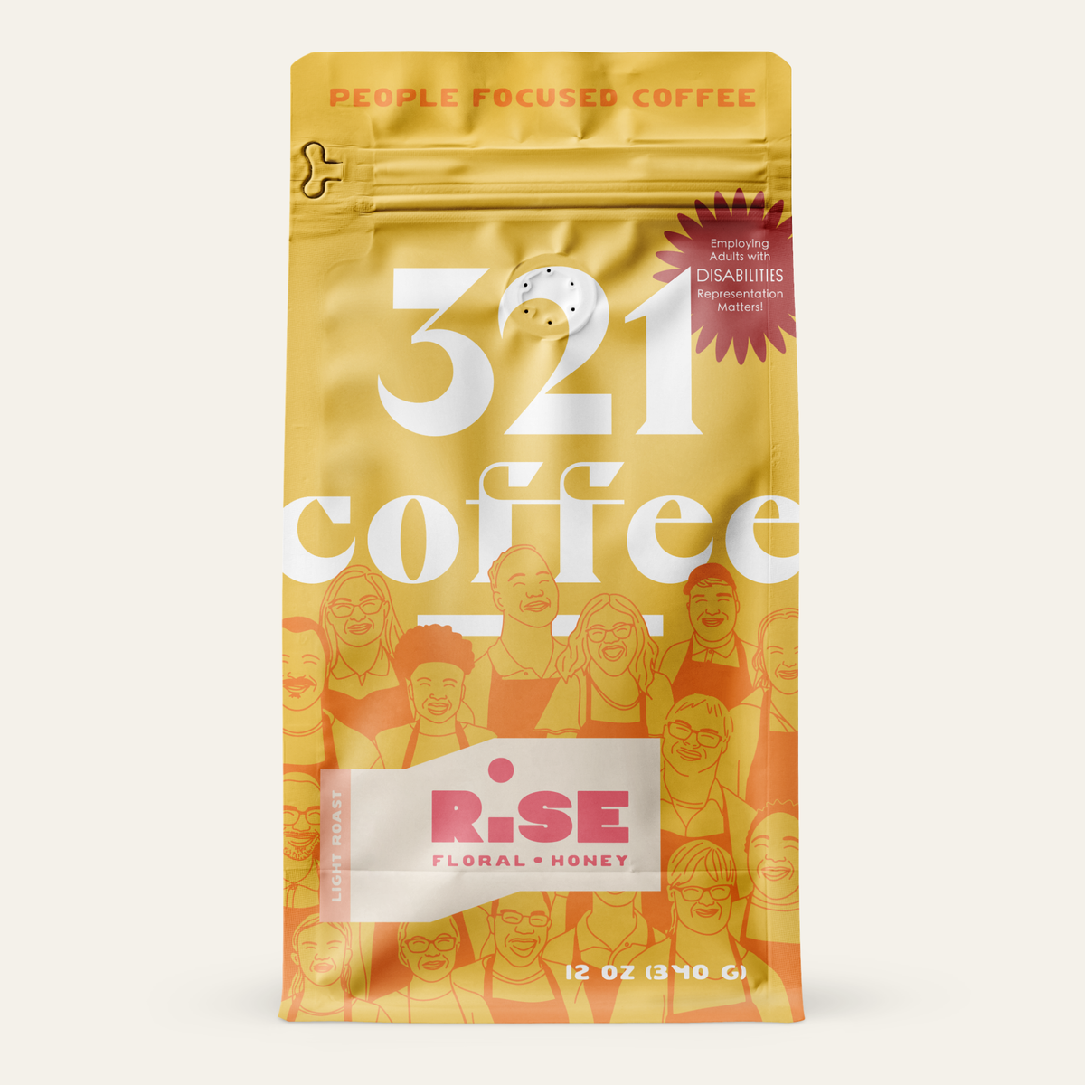 A yellow-colored coffee bag with the text "321 coffee" in large white letters. Above the text, it says "People Focused Coffee" in orange. There is a red starburst label that reads "Employing adults with disabilities. Representation matters." Below, there is a badge for "Rise". The background features illustrations of smiling people.
