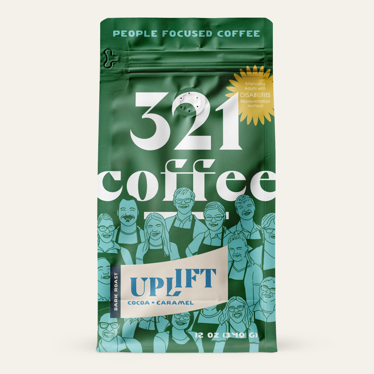 A green-colored coffee bag with the text "321 coffee" in large white letters. Above the text, it says "People Focused Coffee" in teal. There is a yellow starburst label that reads "Employing adults with disabilities. Representation matters." Below, there is a badge for "Uplift". The background features illustrations of smiling people.
